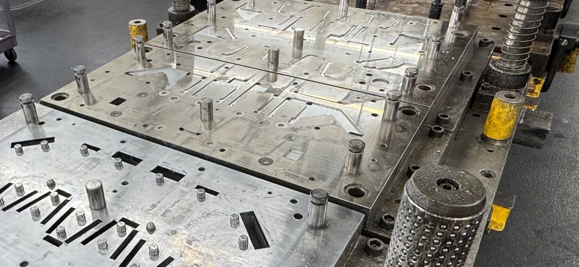 Optimizing part geometry for high-volume metal stamping production